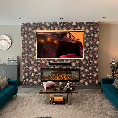 Renovated lounge with feature media wall and electric fireplace