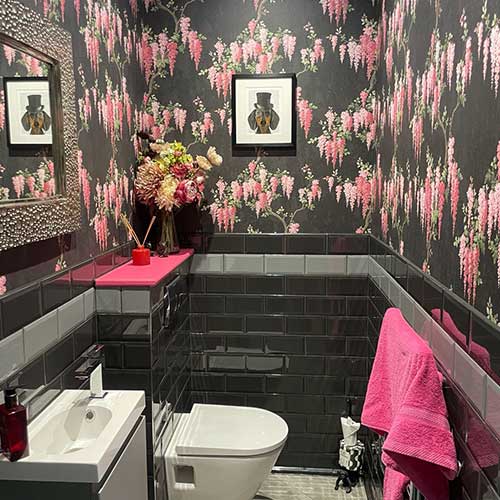 Downstairs WC with black metro tiles and wall-hung basin