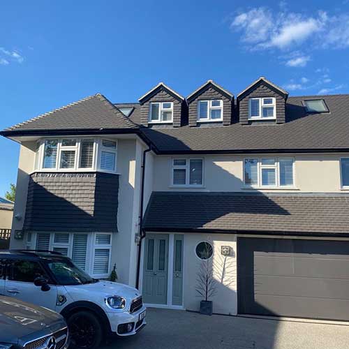 Two-storey side extension with dormer loft and double garage