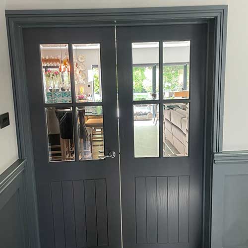 Glazed internal double doors between dining and living rooms
