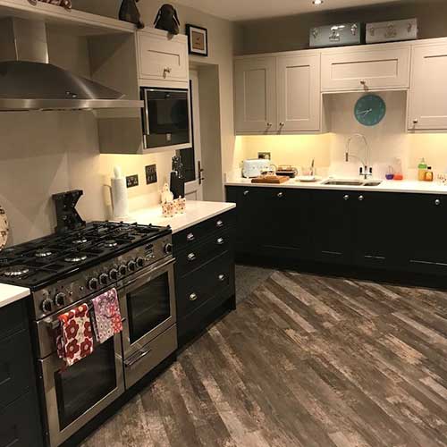 Shaker kitchen refit with range cooker and wood-effect flooring