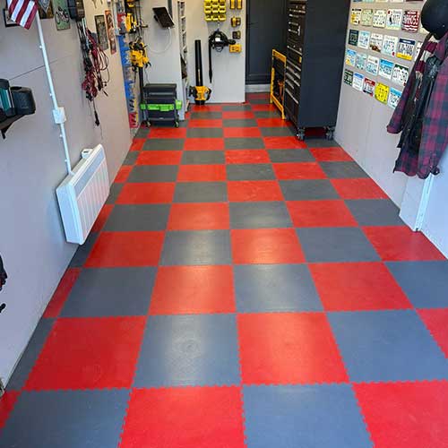 Converted garage fitted with interlocking checkerboard floor tiles