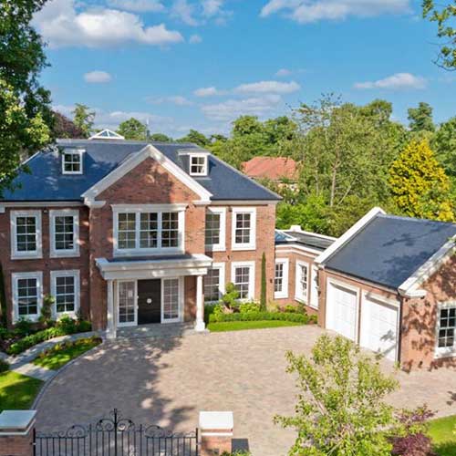 Large detached brick new-build house with double garage