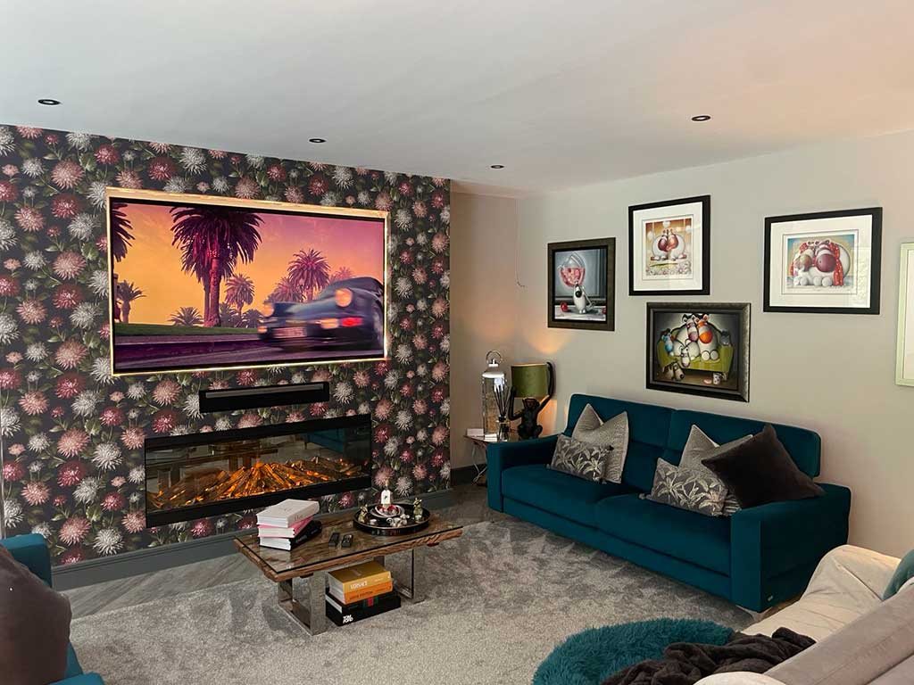 Living room with a media wall fire and floral feature wall