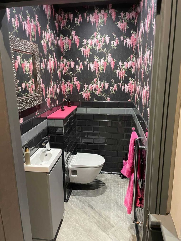 Cloakroom with a wall hung toilet, basin and metro tiling