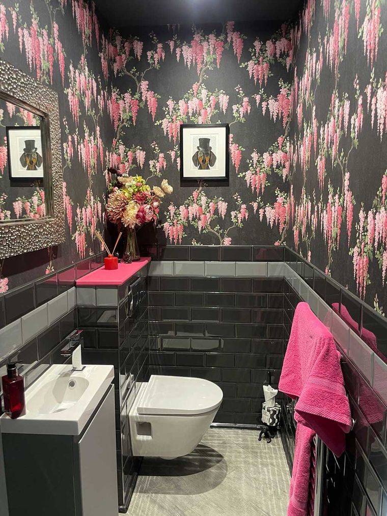 Downstairs WC with black metro tiles and a wall hung basin