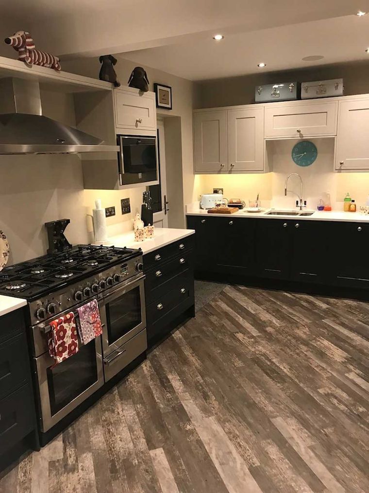 Shaker kitchen refit with a range cooker and wood effect flooring